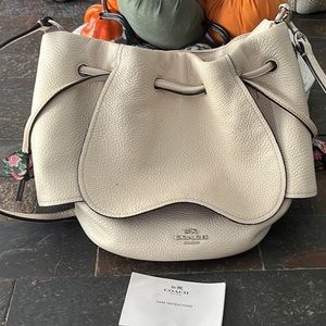 Coach drawstring w/ floral details. Excellent condition limited edition. L1657